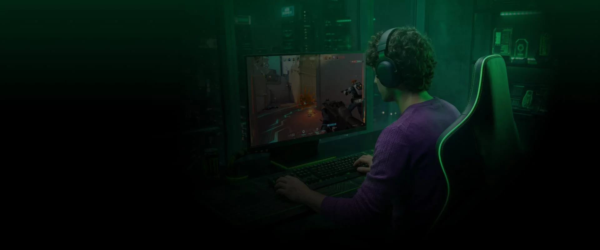Gamer wearing headphones playing a PC shooting game with LagZapper lag reducer